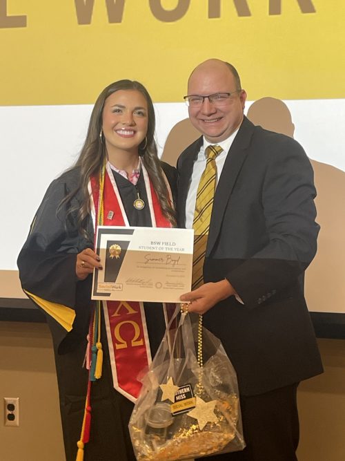 Summer Boyd and Scott Mullins posed with BSW Field Student of the Year Certificate posing after Summer's graduation.