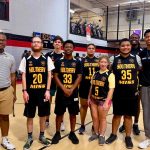 SO College Athletes posing in YMCA basketball court after the game.