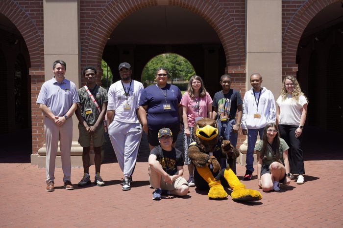 RISE Summer College Readiness Program students stand in front of Luckyday Hall on Southern Miss campus.
